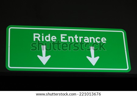 Ride Entrance Sign on Green Background