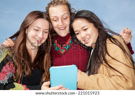 Women look on her tablet computer