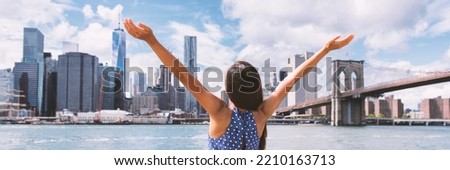 Success in business career in New York City. Panoramic banner. Aspirational Happy free woman cheering by NYC New York city skyline with arms up. Goal achievement carefree freedom successful person