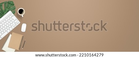 Flay lay work desk table with computer , book , coffee on brown pastel color tone background include empty space for product or text graphic advertise