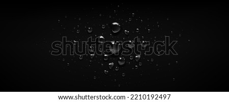 Water drops on black background. Rain condensation, raindrops or glass spheres on dark window surface. Abstract wet texture, backdrop, graphic template for ads design, Realistic 3d vector illustration Royalty-Free Stock Photo #2210192497