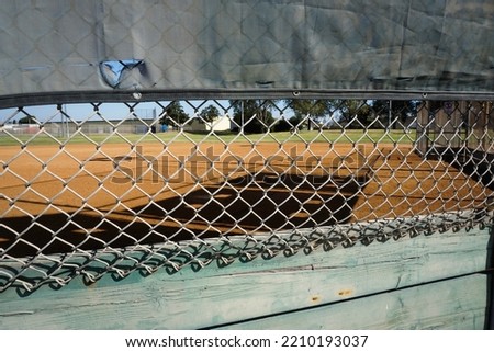 Baseball and softball field behind fence