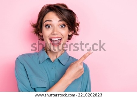 Closeup photo of young attractive adorable funny woman open mouth speechless cute finger directing empty space ad shock black friday isolated on pink color background