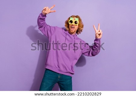 Photo of hooray beard young guy dance wear pineapple spectacles sport clothes isolated on violet color background