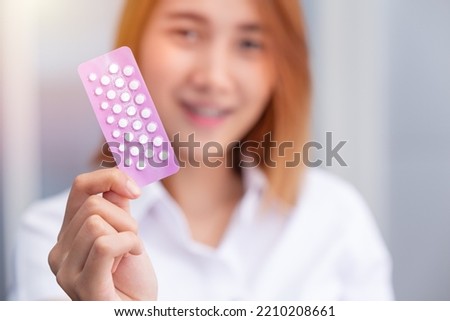 teen girl with birth control pills Combined Oral Contraceptive Pill, COCP show up happy smile