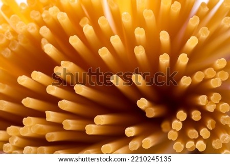 Macro of raw spaghetti, italian food  Royalty-Free Stock Photo #2210245135