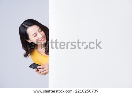Image of young Asian woman with white board