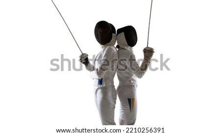Two female fencing athletes fight isolated on white Royalty-Free Stock Photo #2210256391