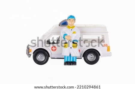 toy doctor and ambulance isolated on white background
