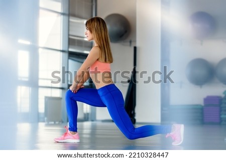 Slim healthy woman doing fitness workout in gym