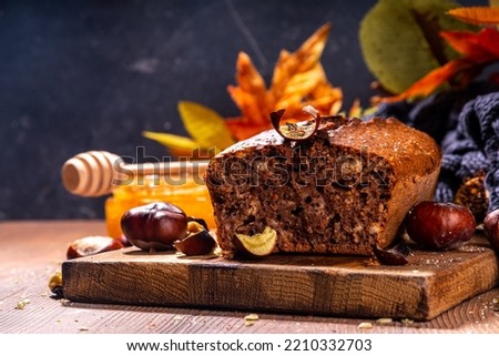Homemade chestnut cake, sweet vegan chocolate chestnut brownie bread with honey and caramel sauce Royalty-Free Stock Photo #2210332703