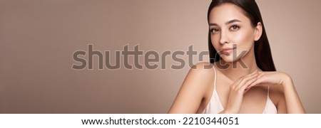Portrait beautiful young woman with clean fresh skin. Model with healthy skin, close up portrait. Cosmetology, beauty and spa Royalty-Free Stock Photo #2210344051