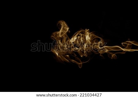 Golden smoke on black background