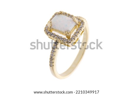 Golden engagement ring with opal and zirconium, isolated on white