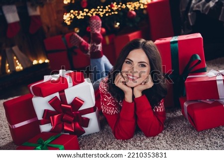 Full size photo of charming positive lady laying carpet floor hands touch cheeks newyear miracle giftbox indoors