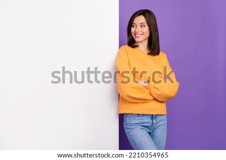 Photo of positive dreamy lady dressed stylish autumn sweatshirt interested look big poster empty space isolated on purple color background Royalty-Free Stock Photo #2210354965