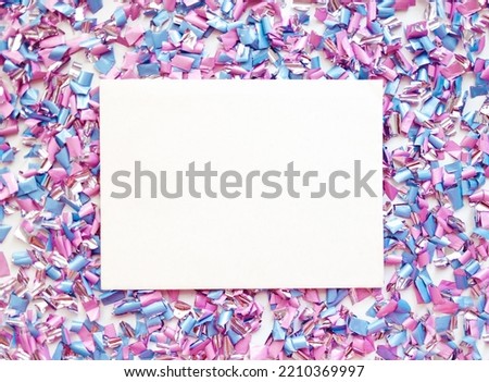 Colorful holiday background with party confetti on pink background.