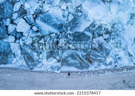 Aerial view of frozen lake. Ice from drone view. Background texture concept.
