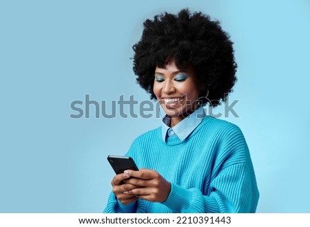 Mockup, smile and black woman with phone typing a online communication message to a contact using social media app. Retro, vintage and happy girl with afro hair doing a internet, web or online search Royalty-Free Stock Photo #2210391443