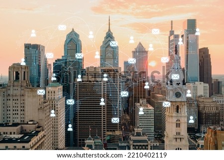 Aerial panoramic cityscape of Philadelphia financial downtown, Pennsylvania, USA. City Hall Clock Tower, sunset. Social media icons. The concept of networking and establishing people connections