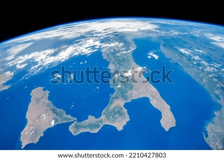 Aerial view of Italy. Mediterranean Sea, Sicily Island and Europe continent as seen from space. Elements of this image furnished by NASA. Royalty-Free Stock Photo #2210427803
