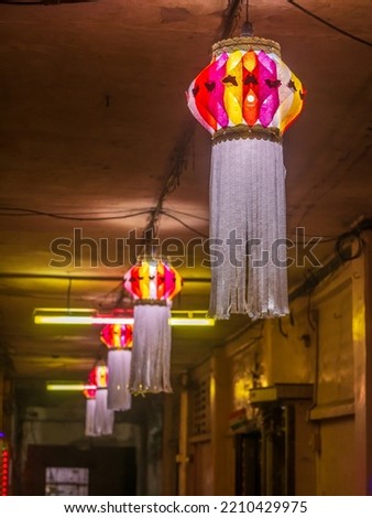 Diwali decorative lamps  or Akash Kandil or Lantern lights hanging outside traditional indian home or chawl in Mumbai Royalty-Free Stock Photo #2210429975