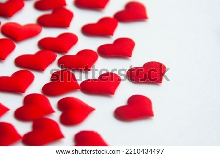 Red heart shapes on white background customizable with space for text. Copy space and relationship concept.