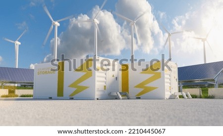 modern battery energy storage system with wind turbines and solar panel power plants in background. New energy concept image Royalty-Free Stock Photo #2210445067