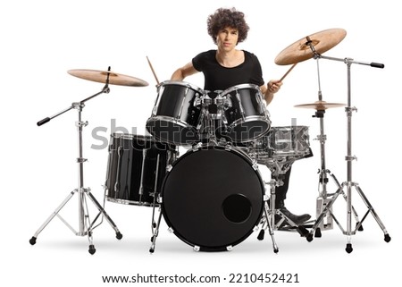 Handsome guy playing drums isolated on white background Royalty-Free Stock Photo #2210452421