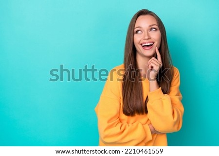 Photo of excited lady feel inspired about news black friday advert on empty space isolated on cyan color background