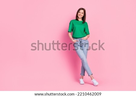 Full length photo of lovely young lady stand crossed legs shopping empty space wear stylish green garment isolated on pink color background Royalty-Free Stock Photo #2210462009