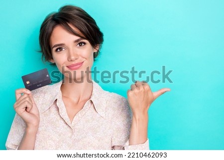 Photo of lovely bob hairdo millennial lady hold card indicate promotion wear white shirt isolated on teal color background
