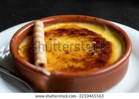 Crema Catalana (crème brûlée dessert) custard with caramel Catalonia Spain Royalty-Free Stock Photo #2210465563