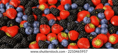 a variation of berry fruits at fruit market Royalty-Free Stock Photo #2210465957