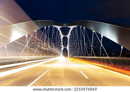 The newly opened Osthafenbrücke in Frankfurt am Main in a night shot with artificial lighting Royalty-Free Stock Photo #2210476869