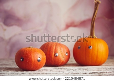 Happy Halloween pumpkins with eyes. Cute funny seasonal family. Copy space