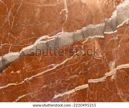 Wall of red marble tiles. Element for design. Background, texture