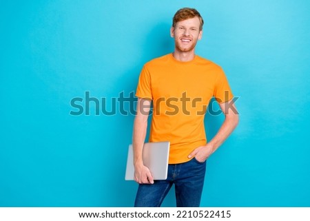 Photo of good looking man buy store center modern netbook device use distance work study empty space isolated on cyan color background
