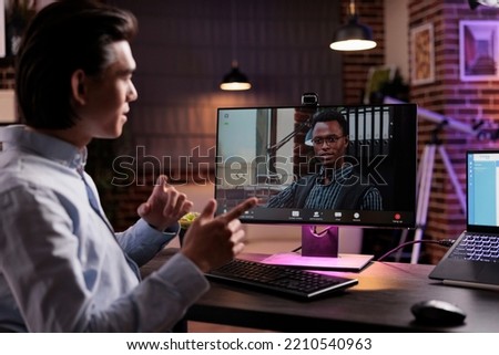 Office worker talking to manager on videocall, using webcam on computer and attending online business eeting. Chatting on remote videoconference, internet teleconference call with colleagues.