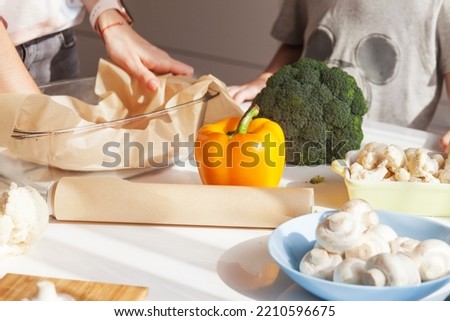 Womam hands. Food background. Food concept. Various fresh Ingredients for cooking. Picture of kitchen table with colorful vegetables . Vegetables for making meal. Selective focus.