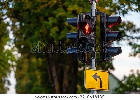 traffic semaphore with red pedestrian light on defocused urban background, close-up Royalty-Free Stock Photo #2210618135
