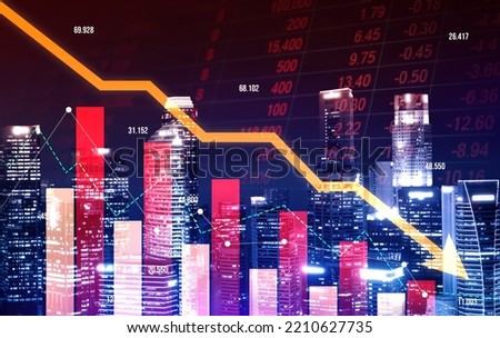 The digital indicators and declining graphs of a stock market crash overlap the backdrop of a modernistic city. Concept of a market crash in double exposure. Royalty-Free Stock Photo #2210627735