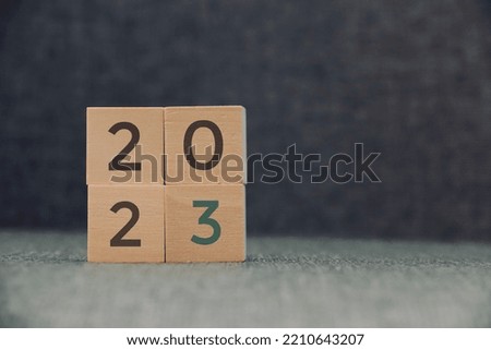 New year 2023 concept, Numbers 2023 on a wooden dice, happy new year concept