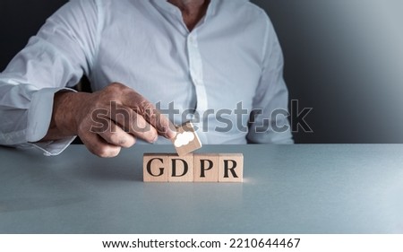 man posing wooden block g d p r or general data protection regulation . concept of internet security . Royalty-Free Stock Photo #2210644467