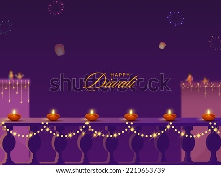 Diwali Celebration Background Decorated With Lit Oil Lamps (Diya), Lighting Garland, Sky Balloons And Buildings.  Royalty-Free Stock Photo #2210653739