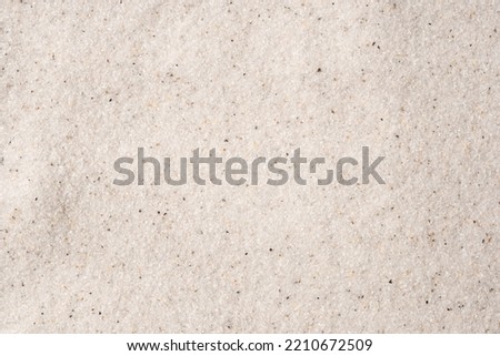 Natural background of white sand. Top view.