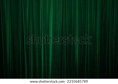 green curtain in theatre background Royalty-Free Stock Photo #2210685789