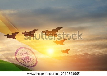 Indian Air Force Day. Indian jet air shows on background of sunset with transparent Indian flag. Commemorate Indian Air Force Day on October 8 in India. Royalty-Free Stock Photo #2210693555