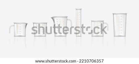 Set of plastic measure jugs. Realistic glass cups with measurement scale for volume isolated on white background. Containers for cooking or chemicals. Vector illustration Royalty-Free Stock Photo #2210706357