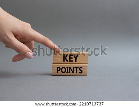 Key points symbol. Wooden blocks with words Key points. Beautiful grey background. Businessman hand. Business and Key points concept. Copy space.
